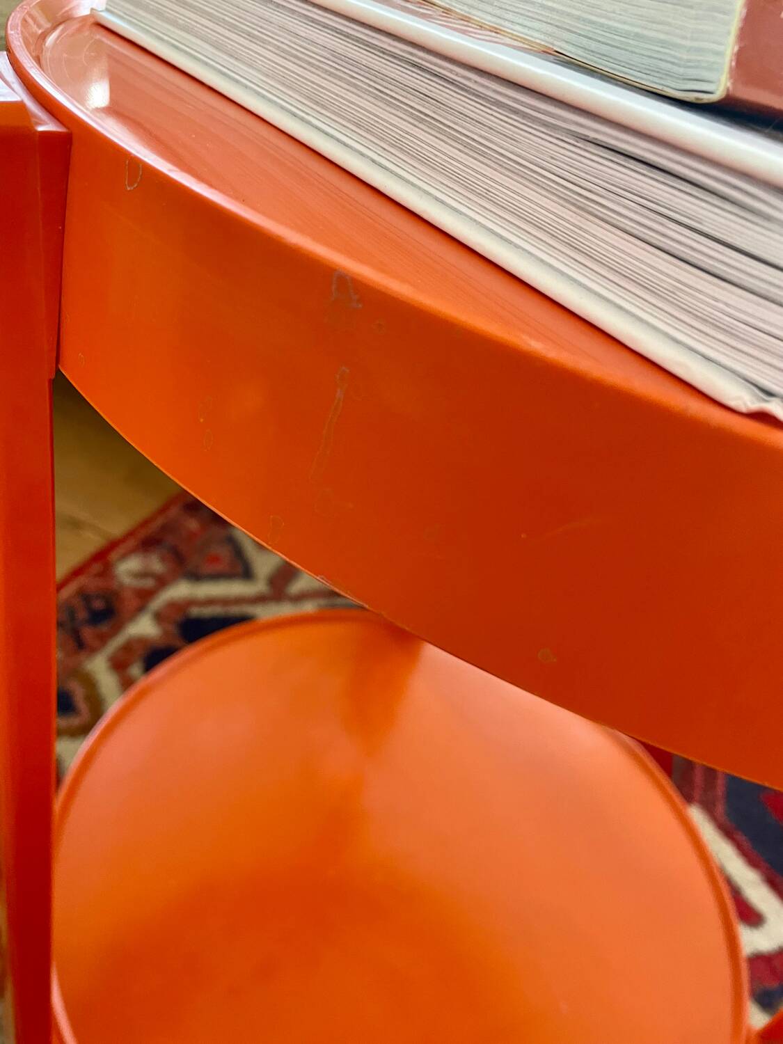 Round orange plastic side table 1970