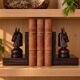 Pair of vintage wooden bookends with stylised horse heads.