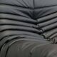 Togo armchair and footrest in black leather by Ligne Roset, designed by Michel Ducaroy.