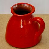 Orange earthen glazed pitcher