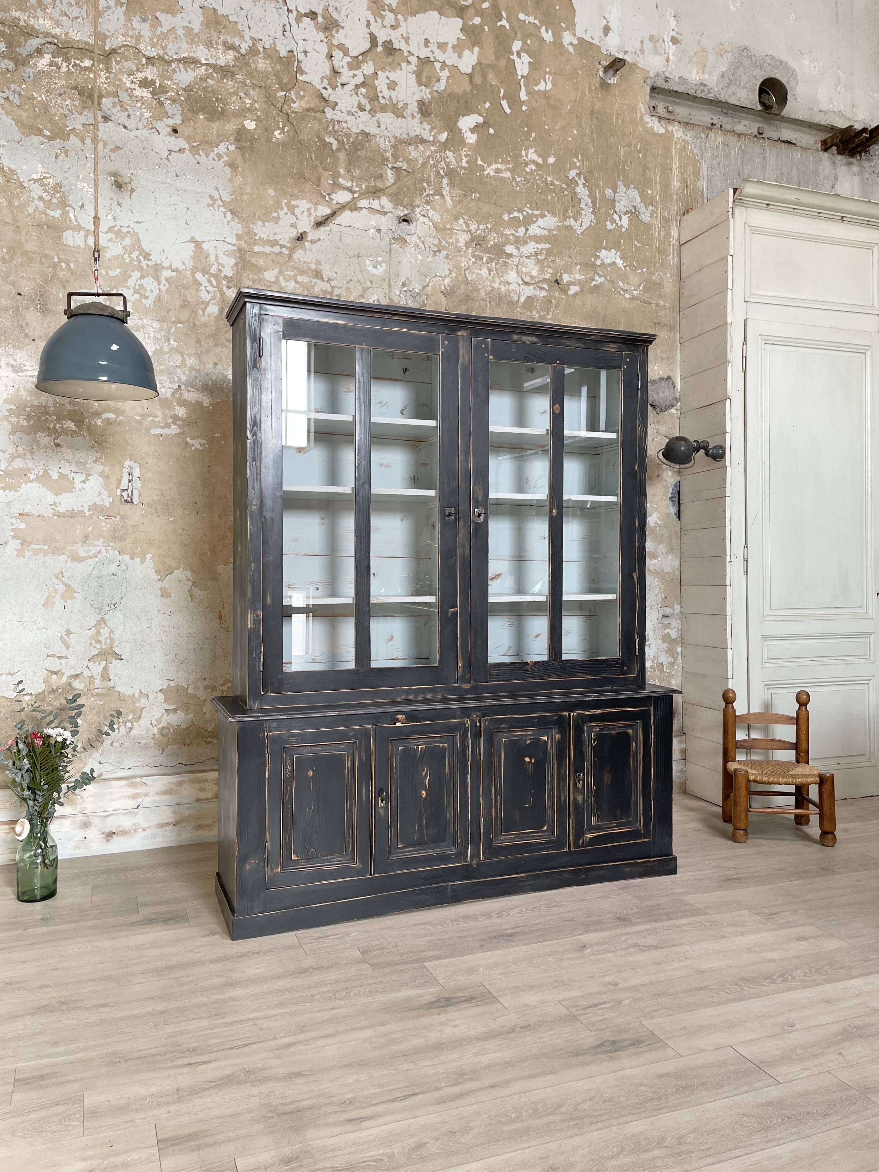 Display cabinet in patinated wood