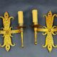 Pair of electrified golden wrought iron gothic wall sconces.
