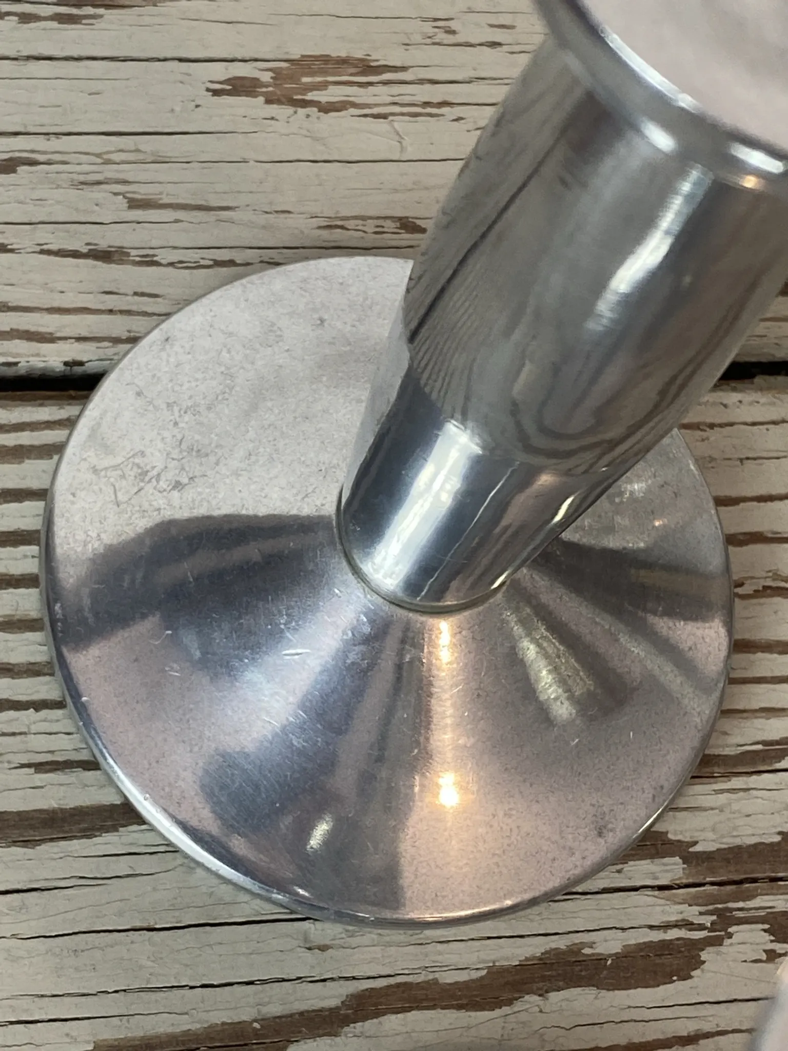 Pair of minimalist polished aluminium candle holders