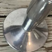 Pair of minimalist polished aluminium candle holders