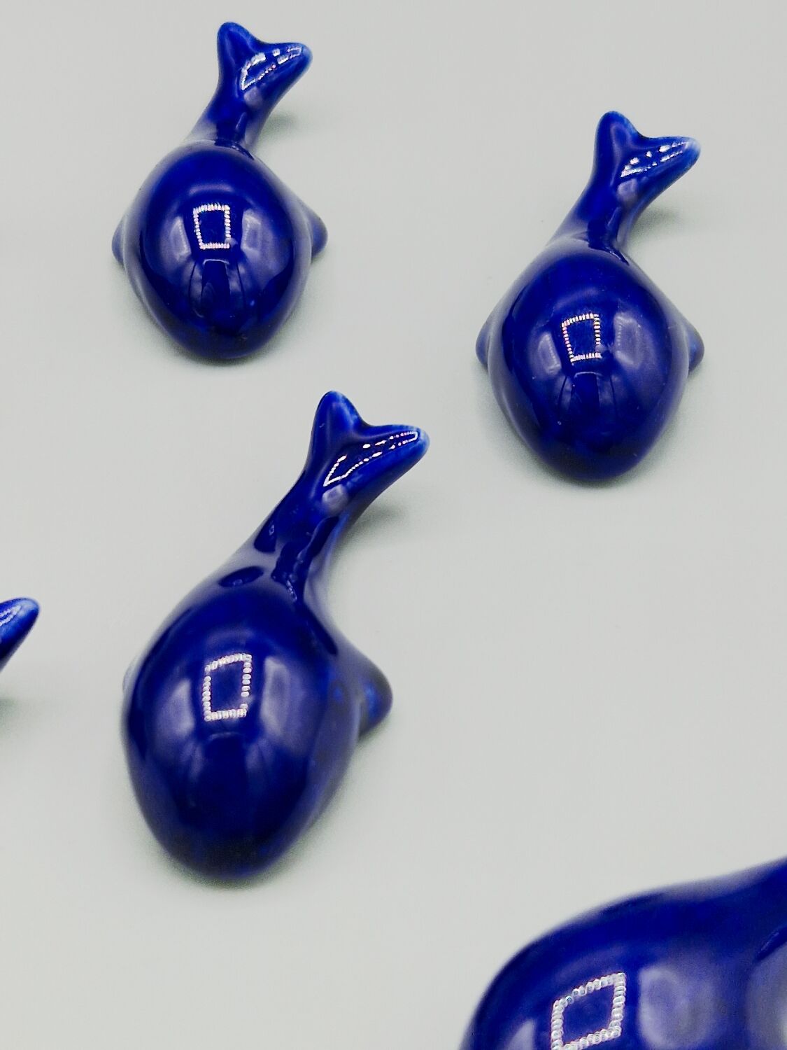 Set of 6 vintage blue porcelain whale knife rests.