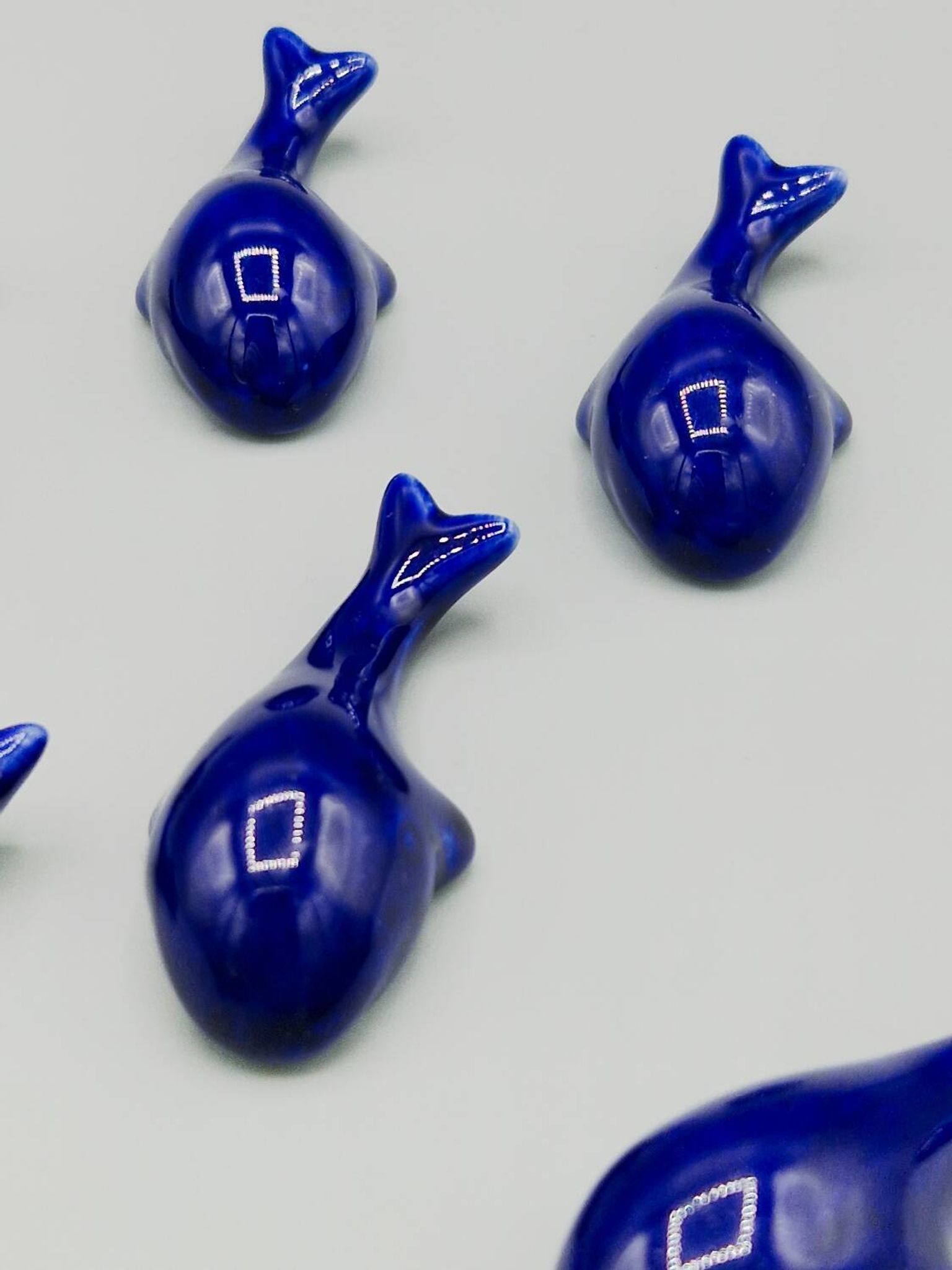 Set of 6 vintage blue porcelain whale knife rests.