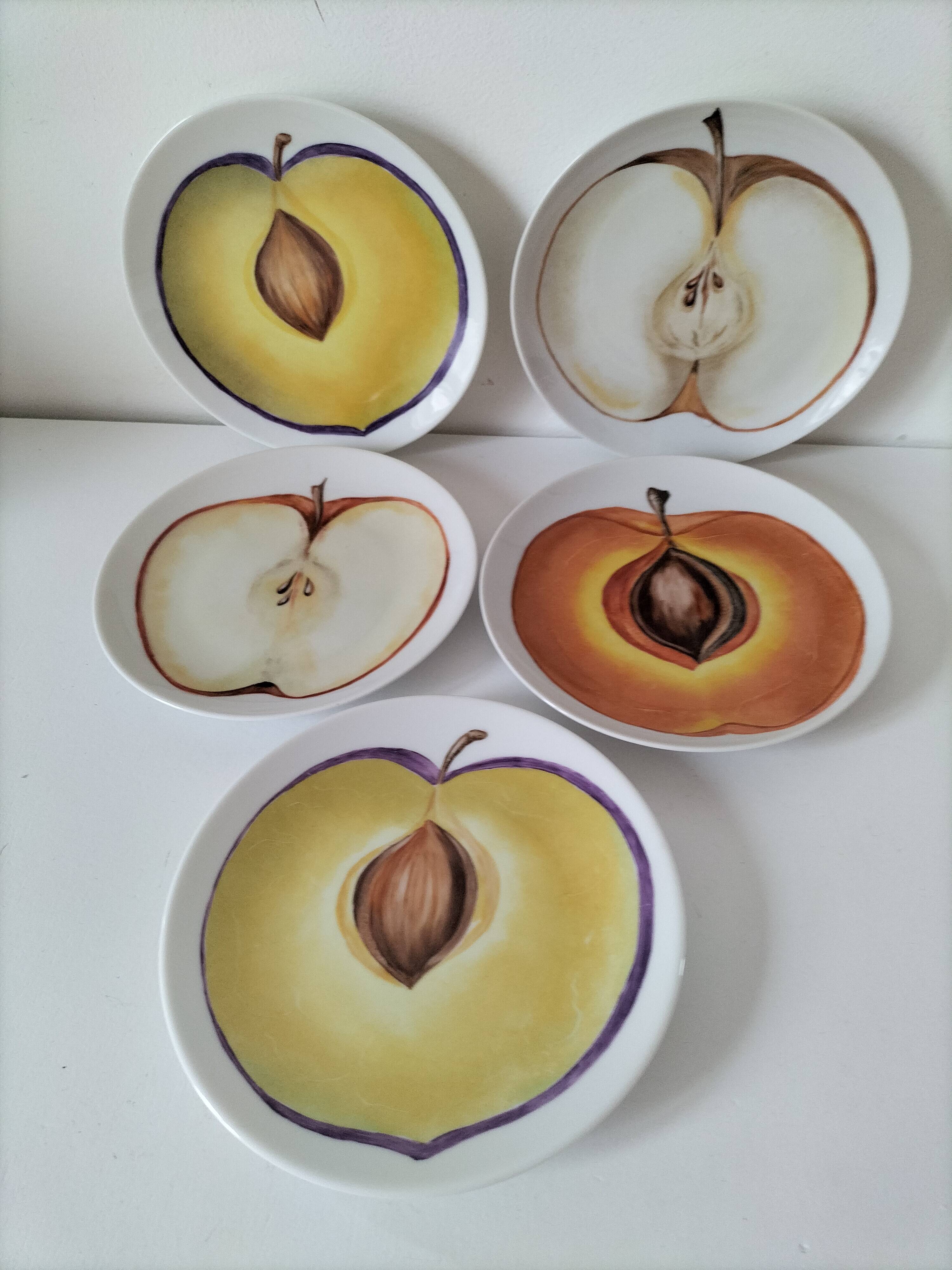 5 hand-painted dessert plates with stylised fruit designs.