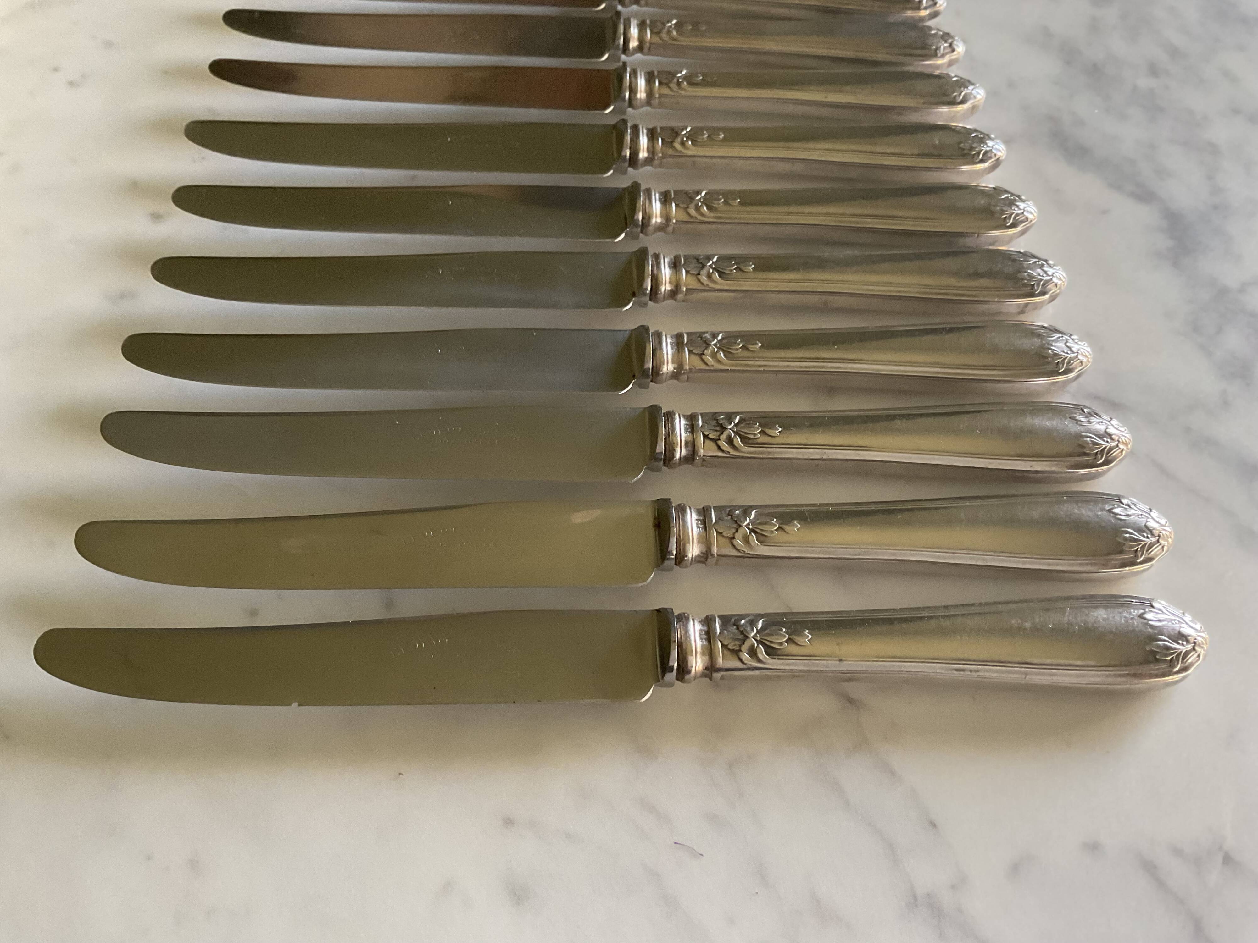 12 silver-plated metal knives. levert silversmith