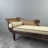 Louis XVI style meridian in carved wood and caning, 19th century.