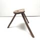 Brutalist tripod stool in solid wood half round