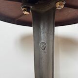 Rare Louis Vuitton cast iron bistro table with a bakelite top.