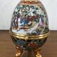 Egg-shaped porcelain jewelry box with asisaisues motifs