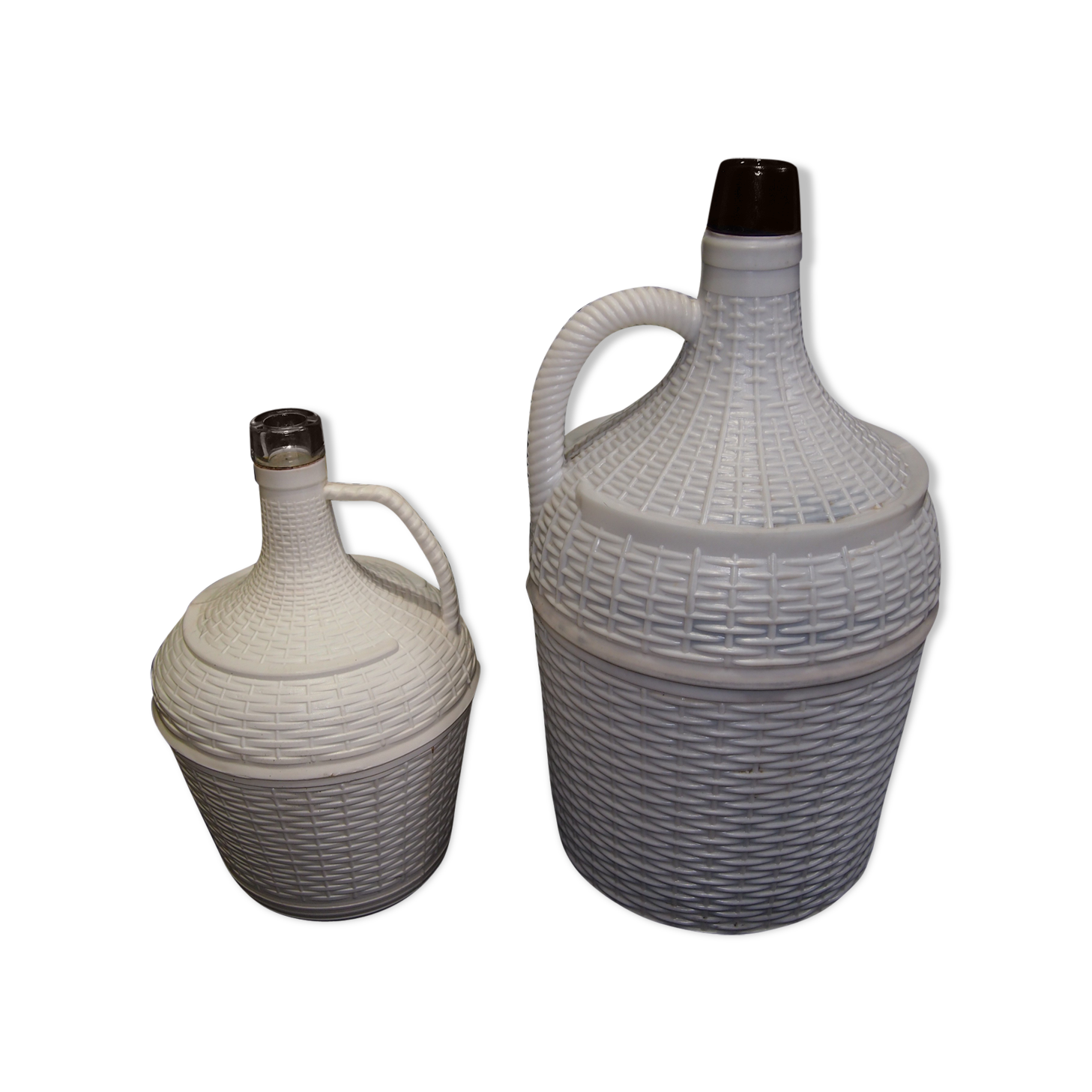 Pair of white covered demijohns