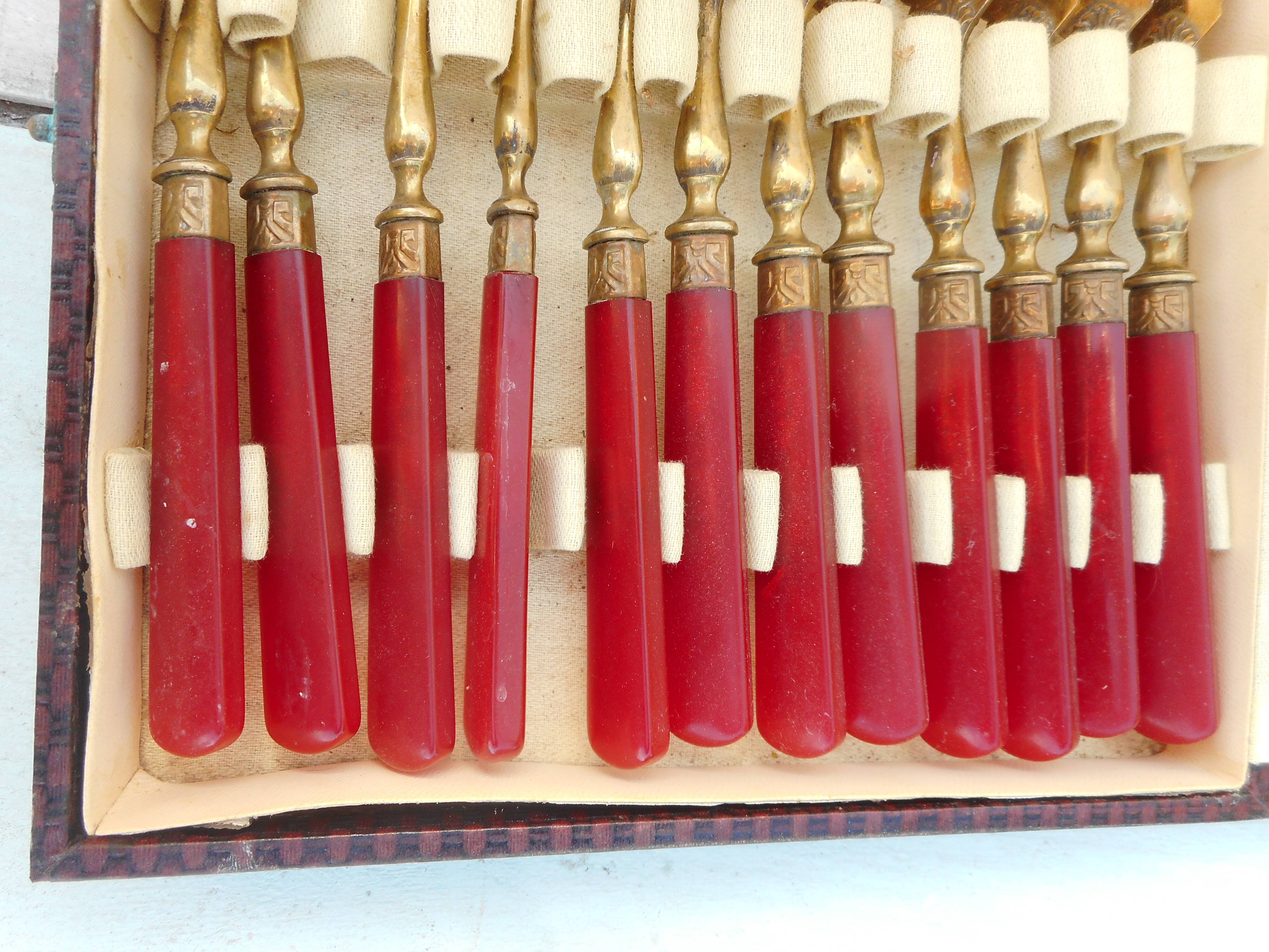 Twelve bakelite handle cake forks