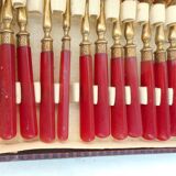 Twelve bakelite handle cake forks