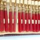 Twelve bakelite handle cake forks