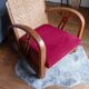 Ancien fauteuil bas colonial style Art Déco en bois.