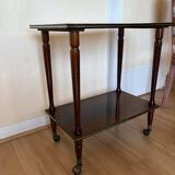 Vintage side table in varnished wood, with casters and gold threads