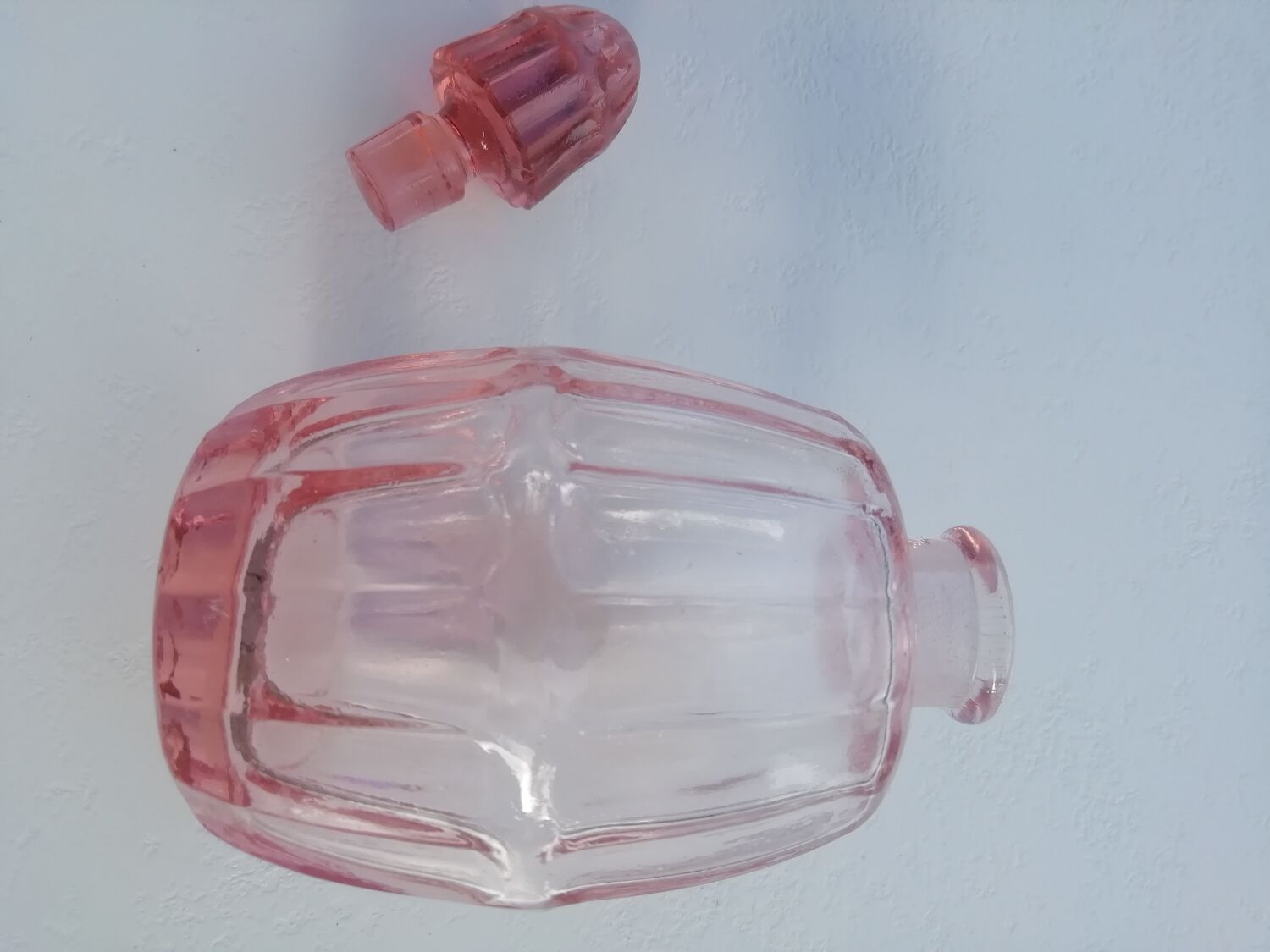 Pink molded glass bottle