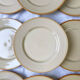 9 mid-century beige Tulowice stoneware plates