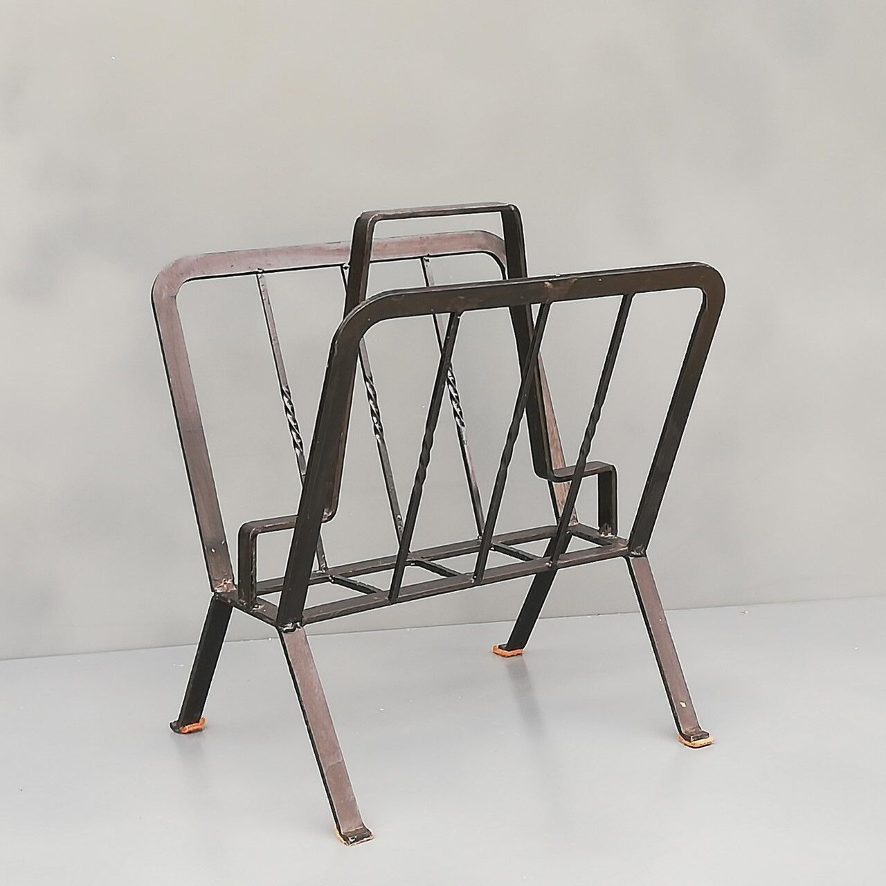 Black painted metal magazine holder