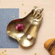 1960s gold-plated brass pear-shaped pocket emptier