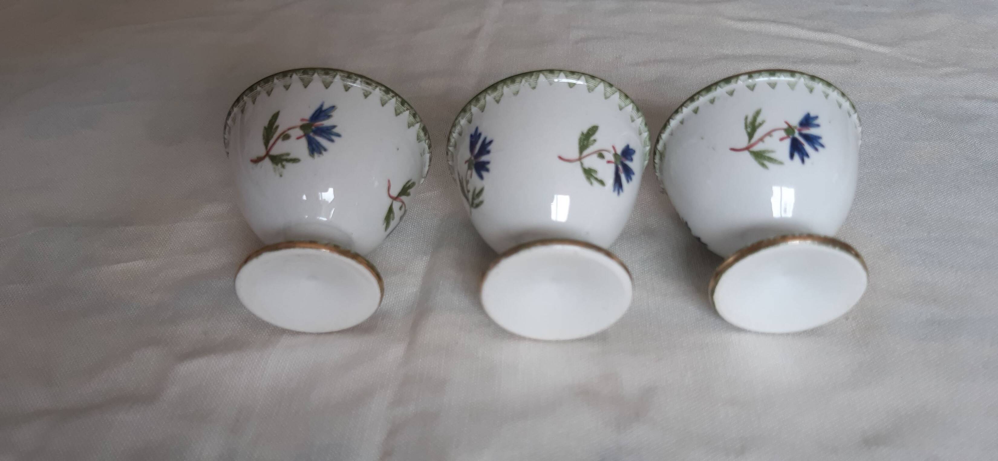 Set of three egg cups, barbel pattern decorations