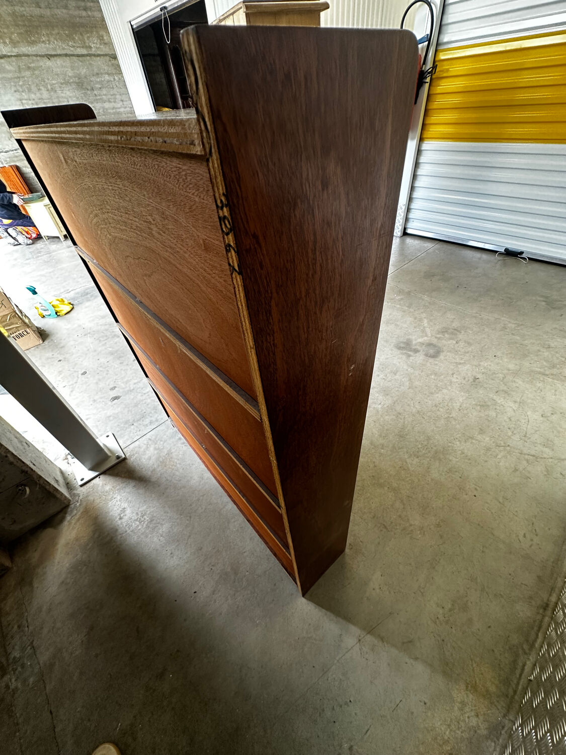Vintage 1960s wooden library with sliding doors.