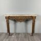 Louis XVI style console in carved wood with a gilded patina, 19th century.