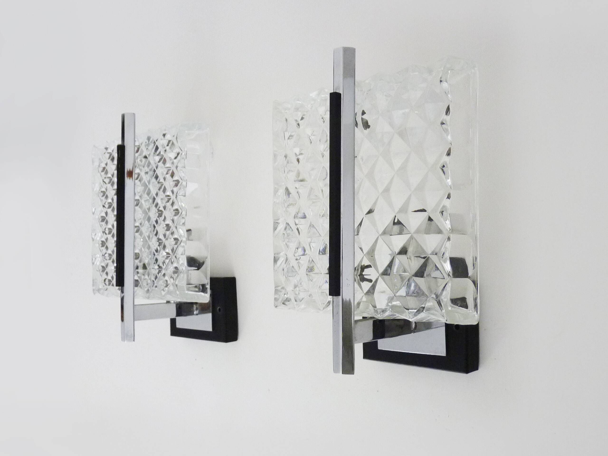 Pair of modernist glass and chrome metal wall sconces. 1960s-70s
