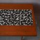 1970s coffee table with a tapered teak base and ceramic mosaic.