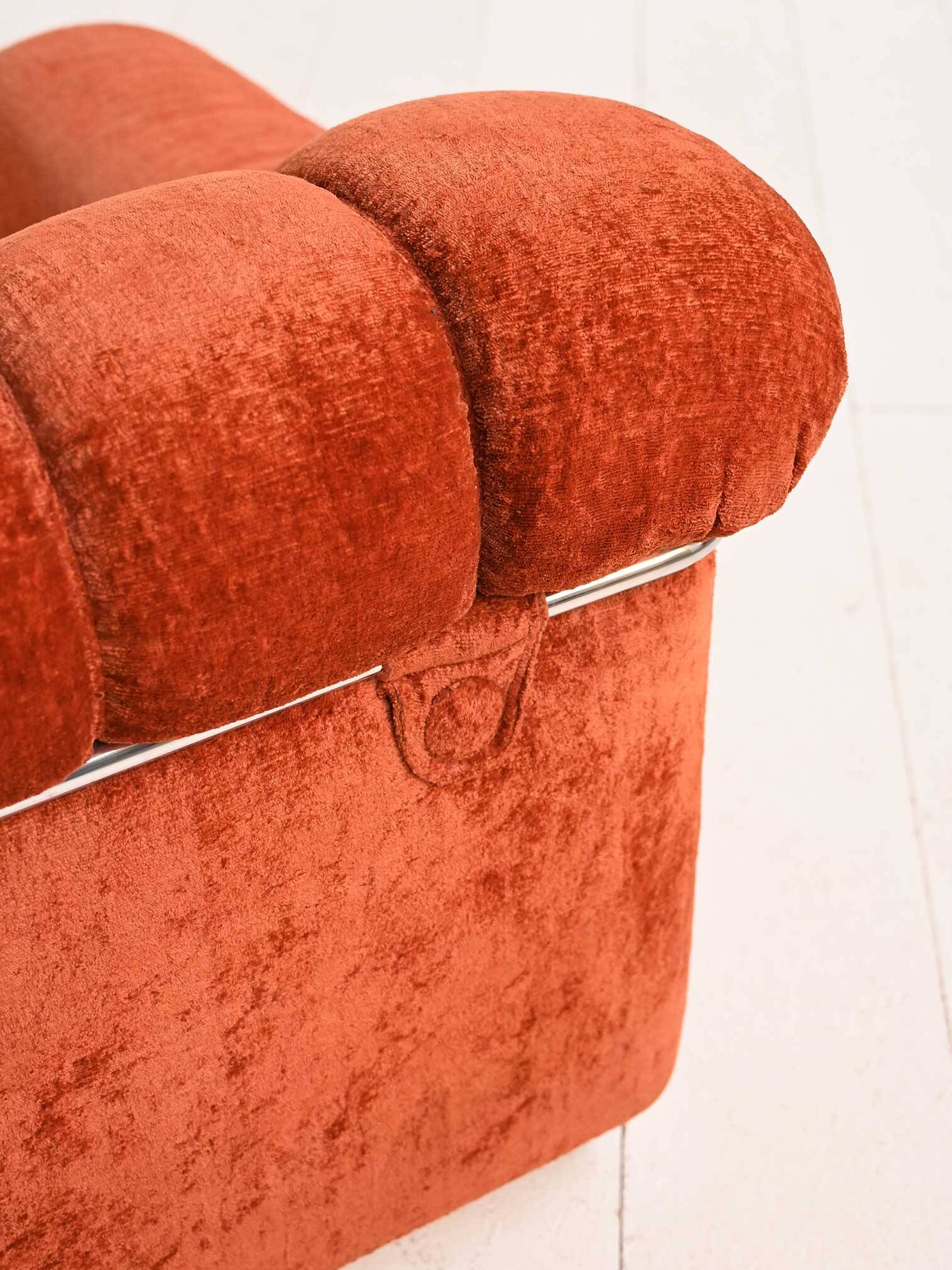 Vintage rust velvet sofa from the 1970s with metal details.