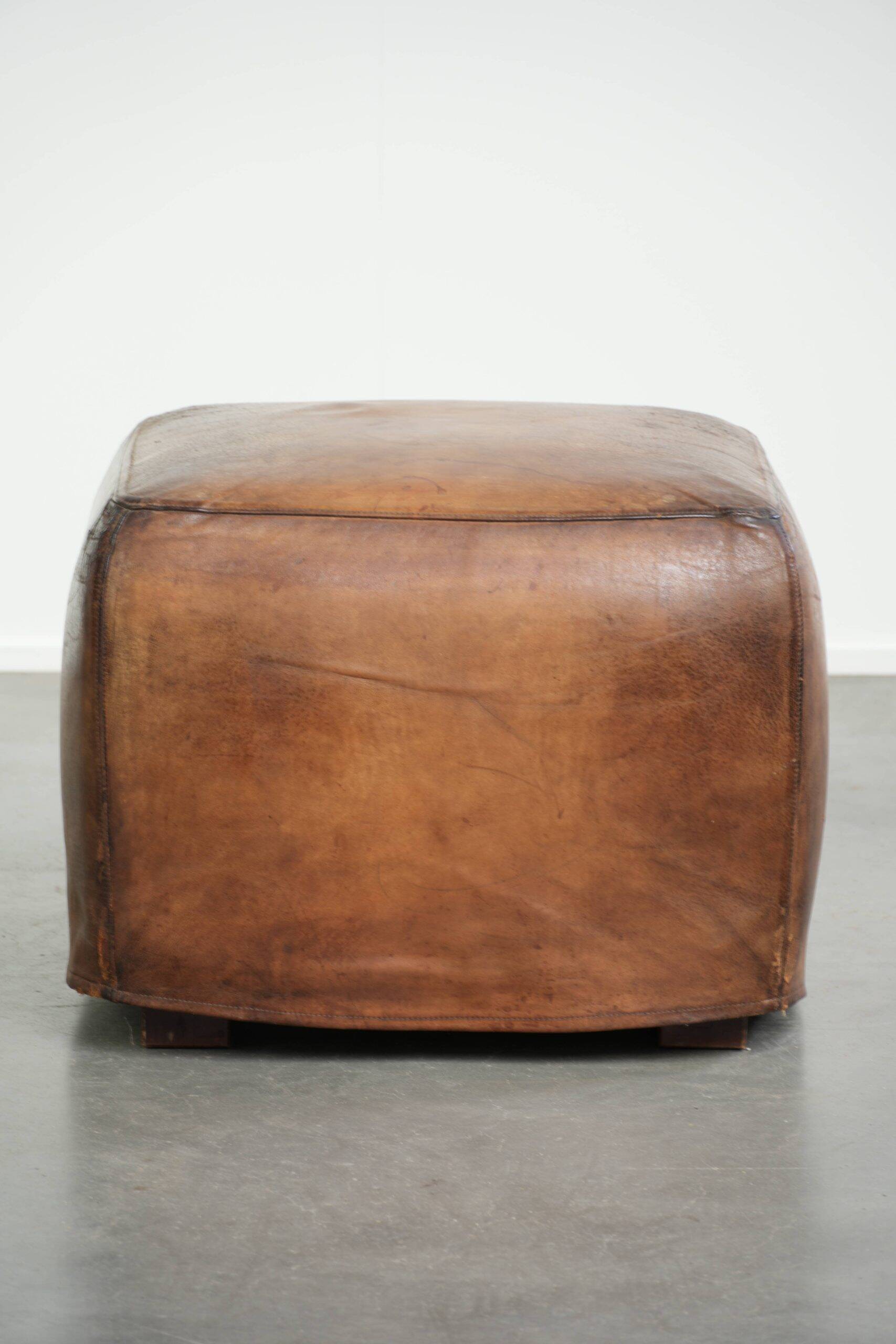 Sheepskin design ottoman with a very beautiful patina and stunning colours