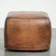 Sheepskin design ottoman with a very beautiful patina and stunning colours