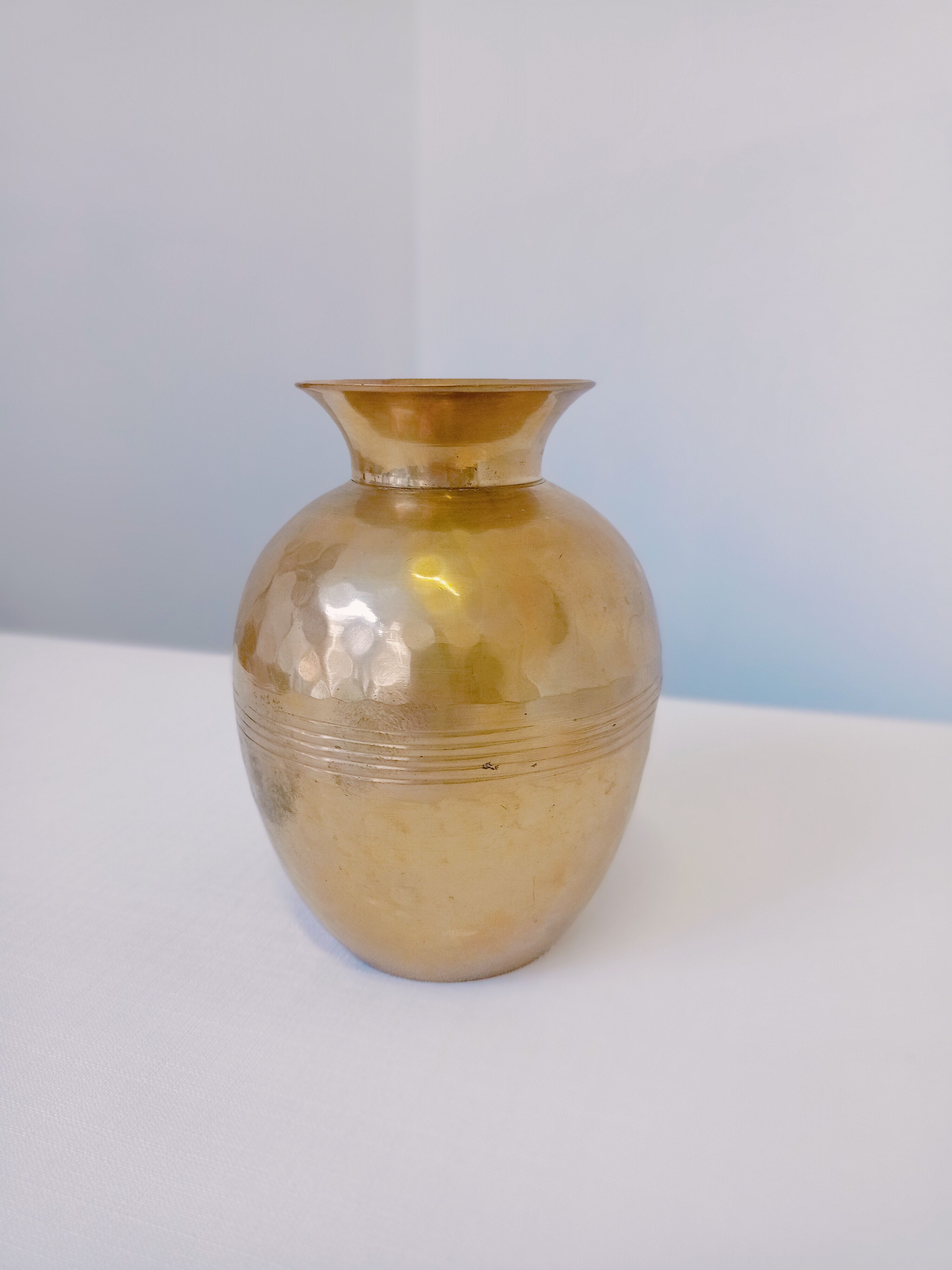 Hammered golden vase