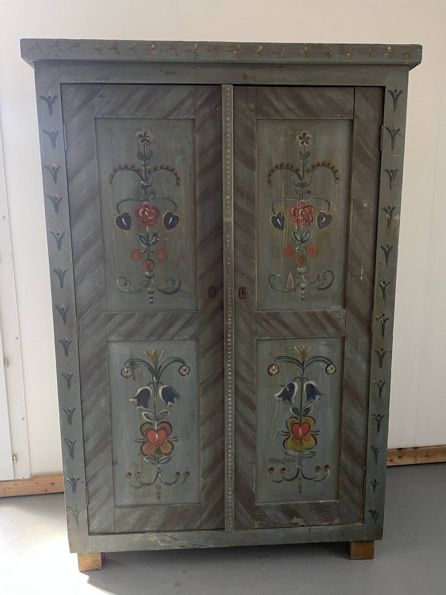 Wedding wardrobe painted in folk art style.