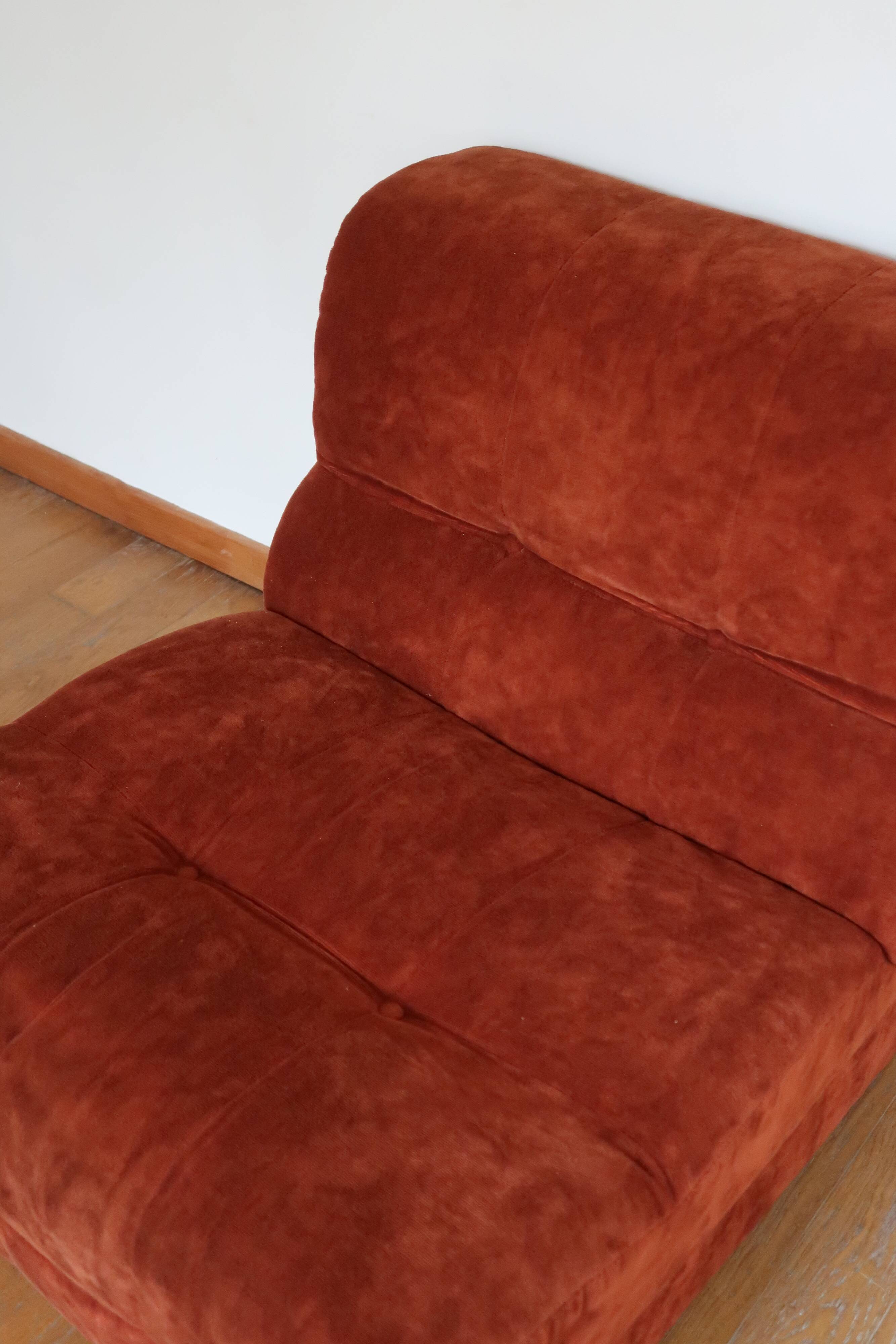 Rusty velvet low chair without arms