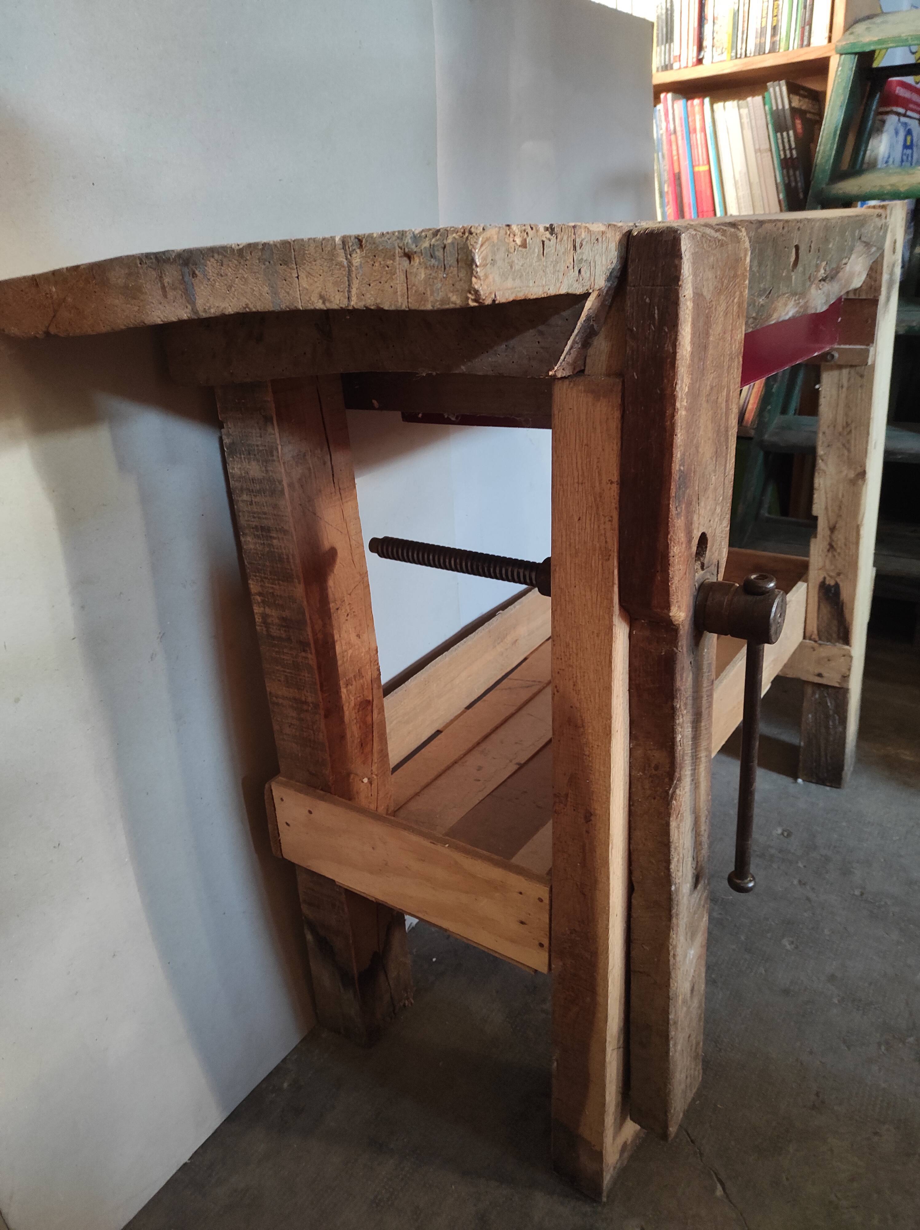 Old homemade vintage solid wood workbench with press and drawer