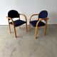 Set of two stackable beech chairs in curved Scandinavian style from IKEA.