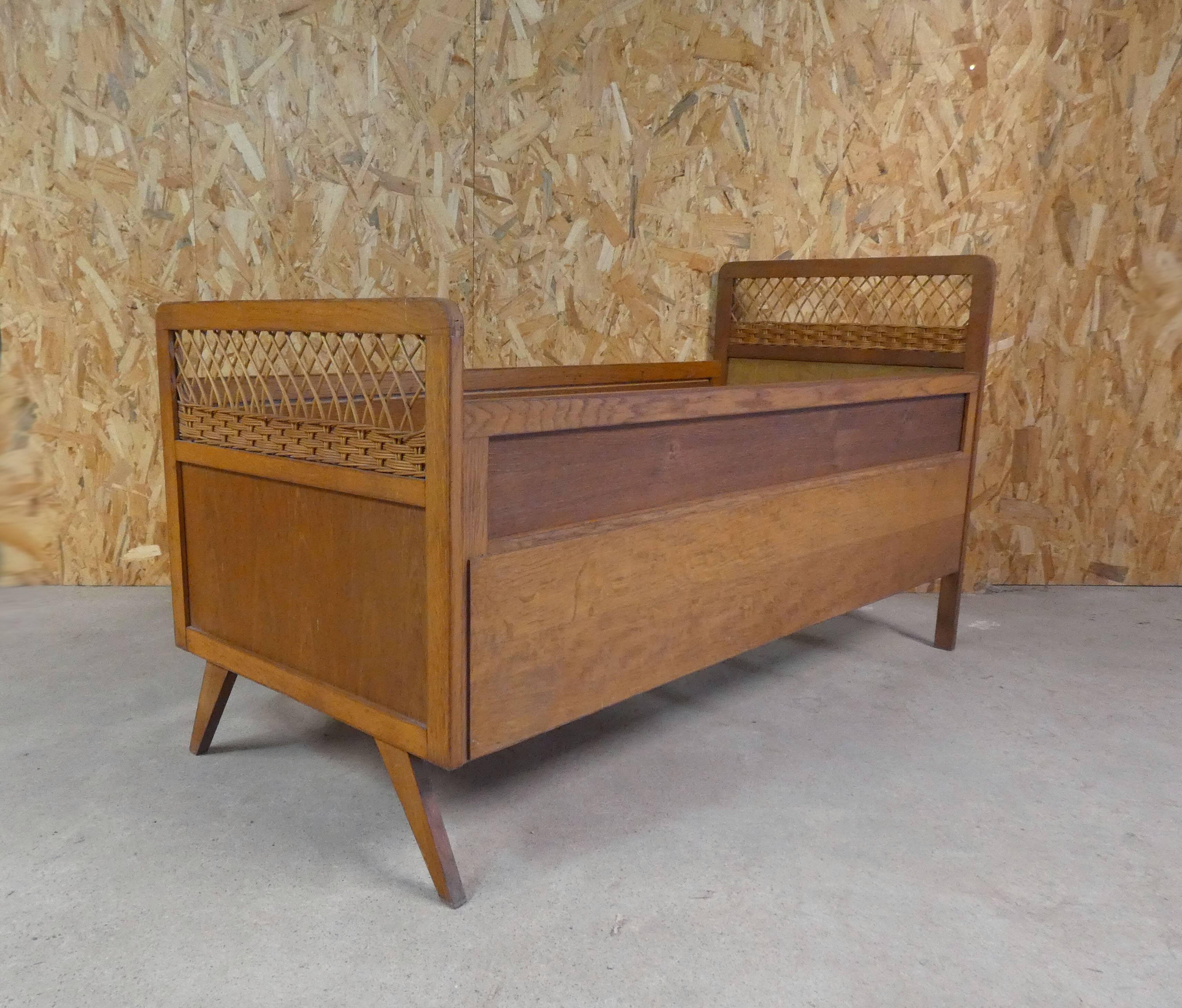 Vintage rattan and wood bed for children's compass feet