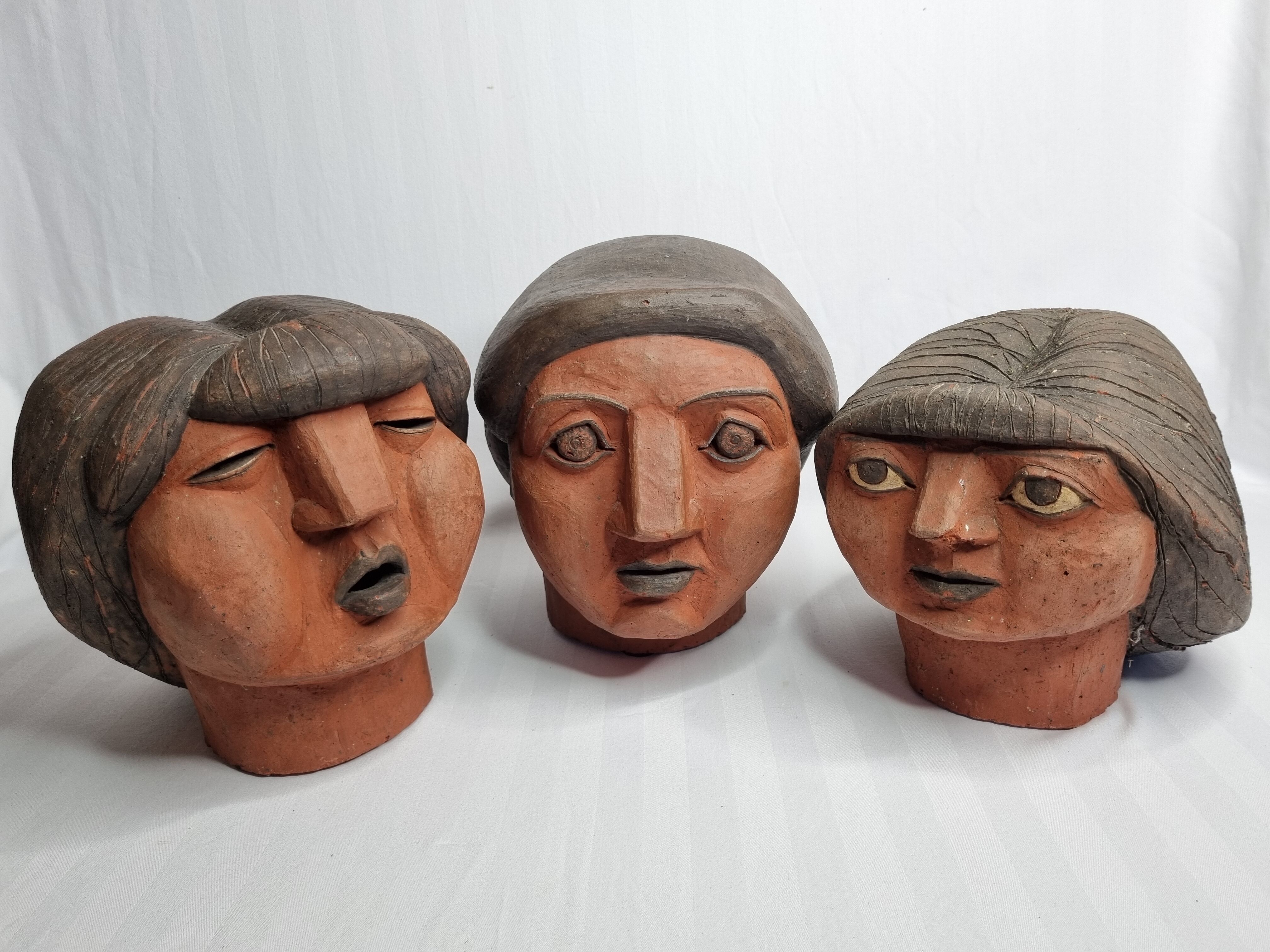Set of 3 decorative women's heads in red terracotta