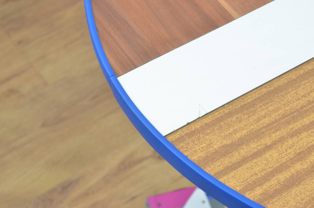 Handmade table made from recycled materials, colourful, abstract.