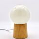 Pair of lamps with wooden base and glass globe, 1970s