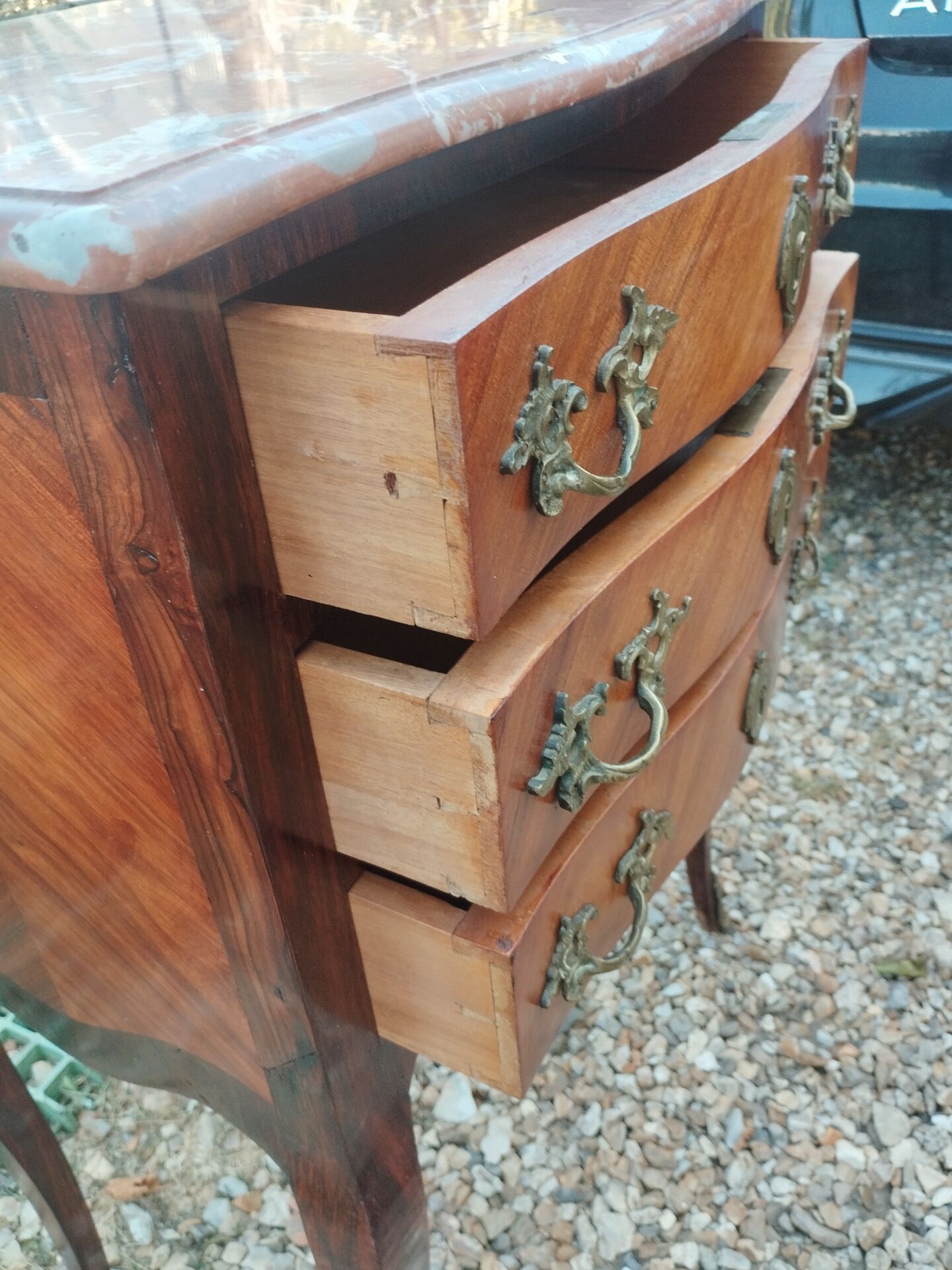 Antique marquetry commode with marble top in Louis XVI style.