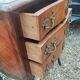Antique marquetry commode with marble top in Louis XVI style.
