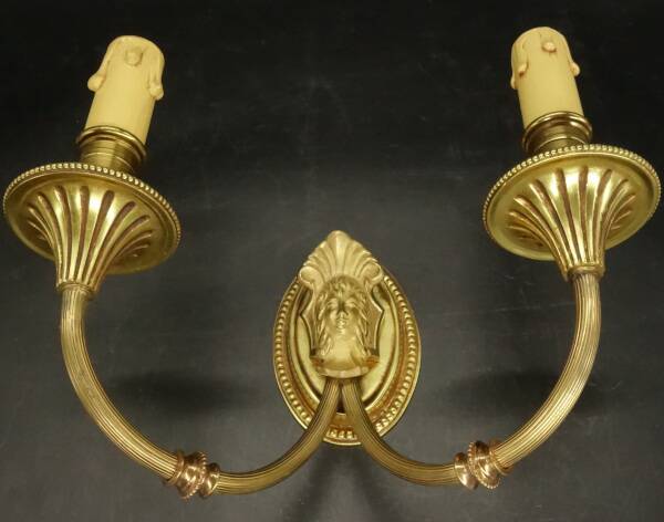 Pair of wall sconces with female masks in Louis XVI style - gilded bronze