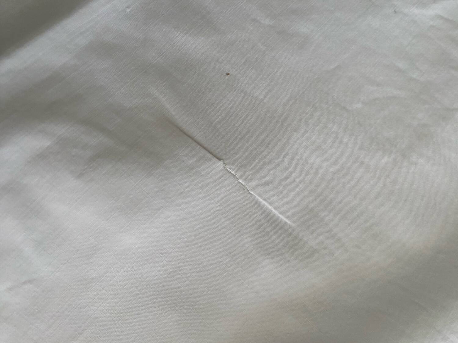 White cotton pillowcase with monogram BC.