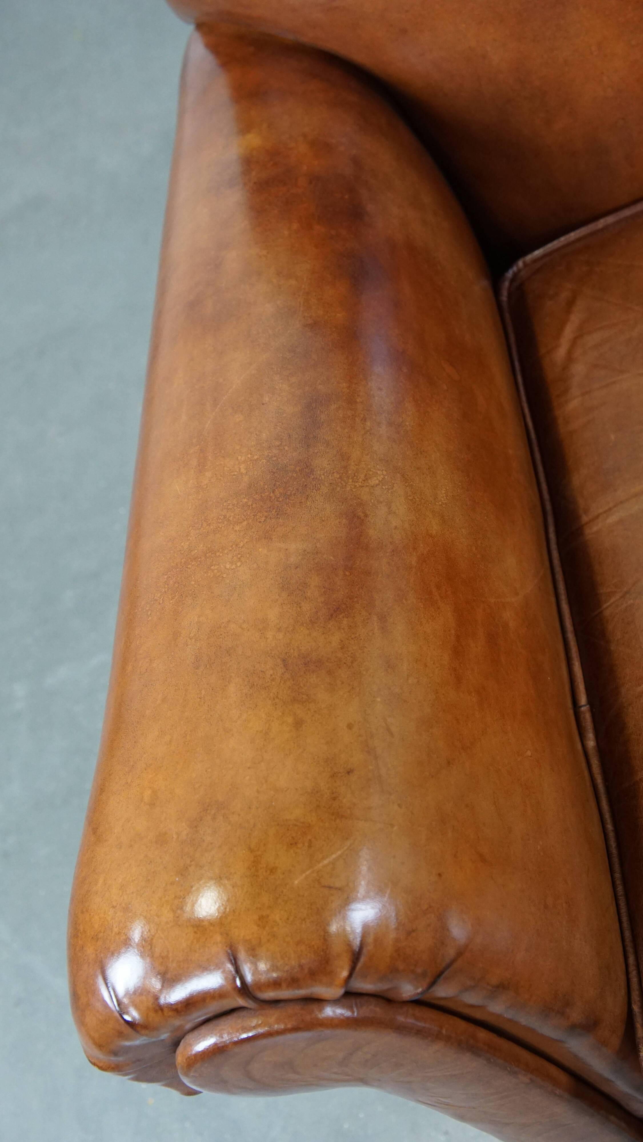 Cognac-colored antique sheep leather armchair