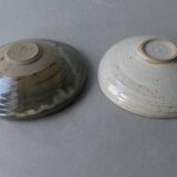 2 enameled stoneware cups, one of which is signed