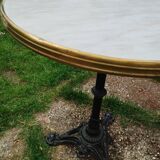 Antique bistro table with marble-decorated top